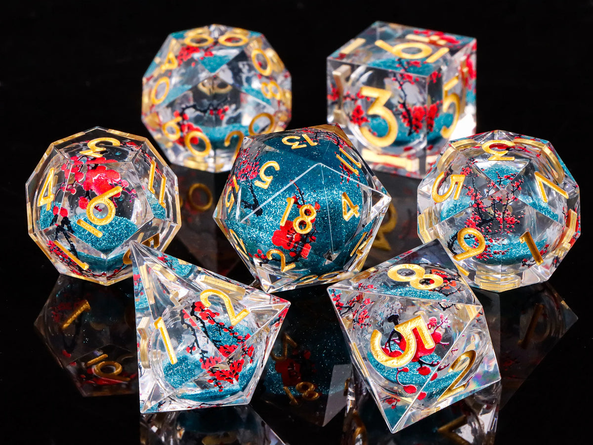 A collection of translucent, faceted polyhedral dice in various colors and patterns, including red and blue accents.
