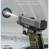 A silver water blaster gun is shown firing a powerful stream of water into a pool.