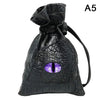 Black PU leather drawstring dice bag with an organizer compartment and a purple eye design