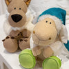 A soft plush toy of a wolf dressed in sheep's clothing, featuring brown fur and white wool with a blue hood.