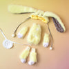 A yellow, fluffy articulated blind box doll with large ears and a white collar is displayed on a light background.