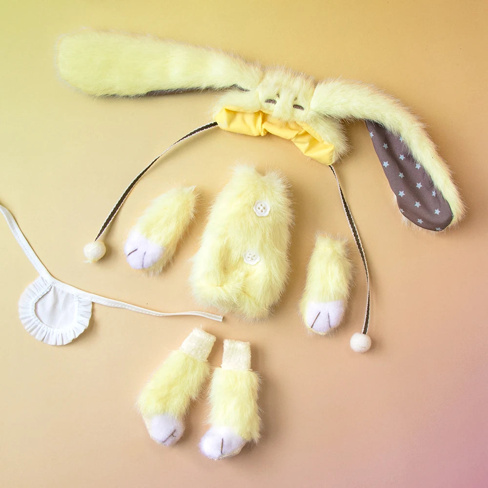 A yellow, fluffy articulated blind box doll with large ears and a white collar is displayed on a light background.