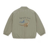 Back view of a khaki padded jacket featuring a graphic print of a dinosaur and a bird.