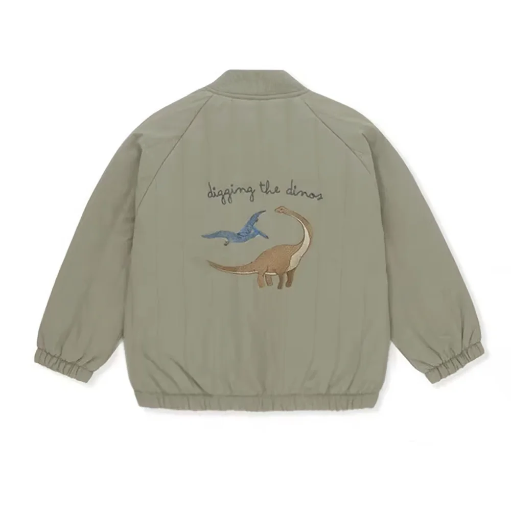 Back view of a khaki padded jacket featuring a graphic print of a dinosaur and a bird.
