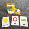 A set of colorful flash cards for kids featuring shapes like flower, ring, and wavy, packaged in bright yellow and orange box