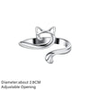 Silver adjustable cat-ear crochet ring with a curved design