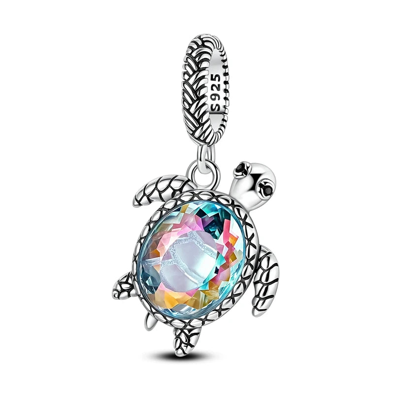 Sterling silver charm pendant set featuring starfish, sea turtle, and whale shark figures.