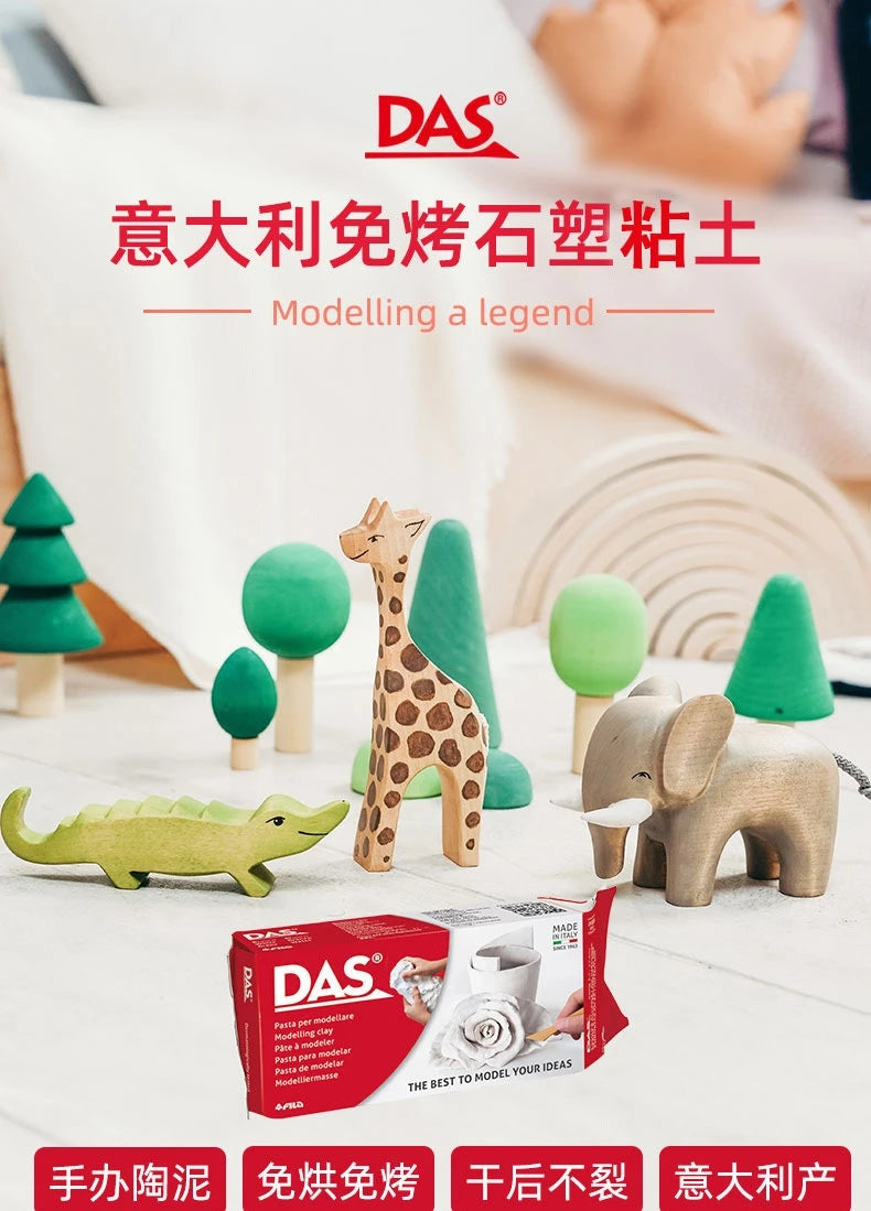 A collection of animal figures made from DAS air dry clay, including a giraffe, elephant, and dinosaur, displayed on a white 