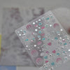 Clear nail art stickers featuring 3D ocean themes like gold shells, starfish, and various colored accents.