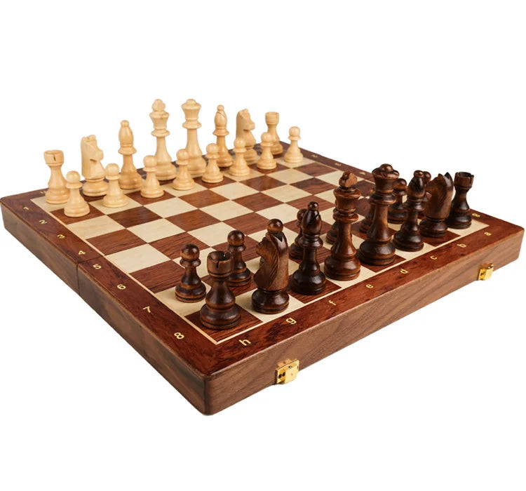 A handcrafted wooden folding chess set with solid walnut pieces on a chessboard.