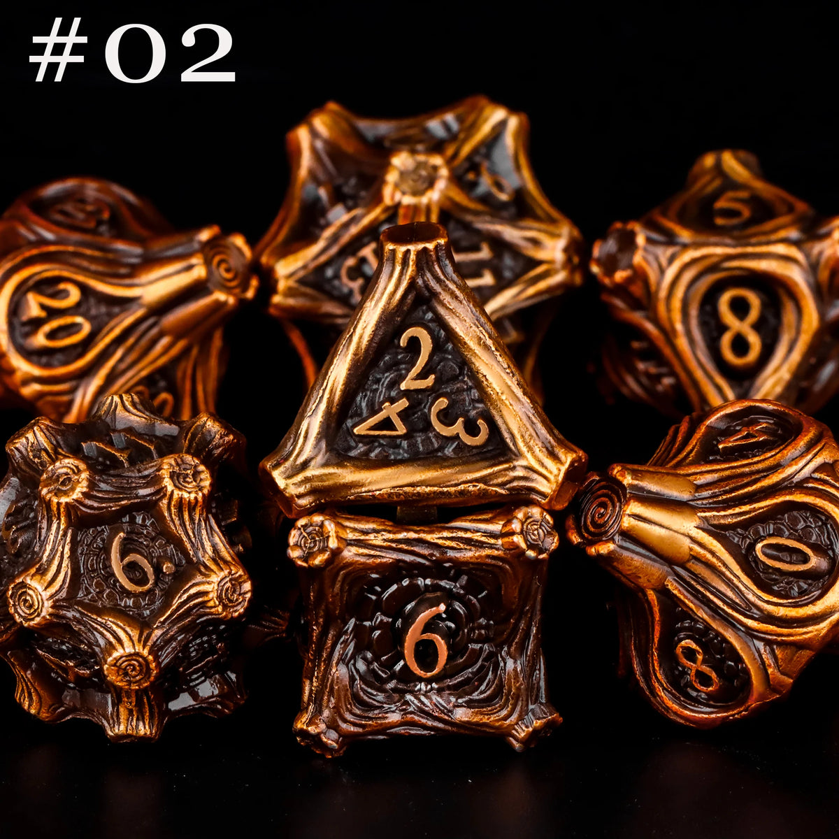 A set of seven polyhedral metal dice in a bronze or gold finish, arranged against a black background.