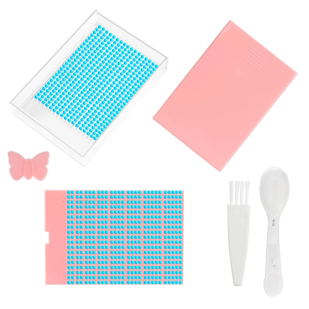 A clear diamond painting storage tray with a lid and a pink plastic card featuring colored beads.