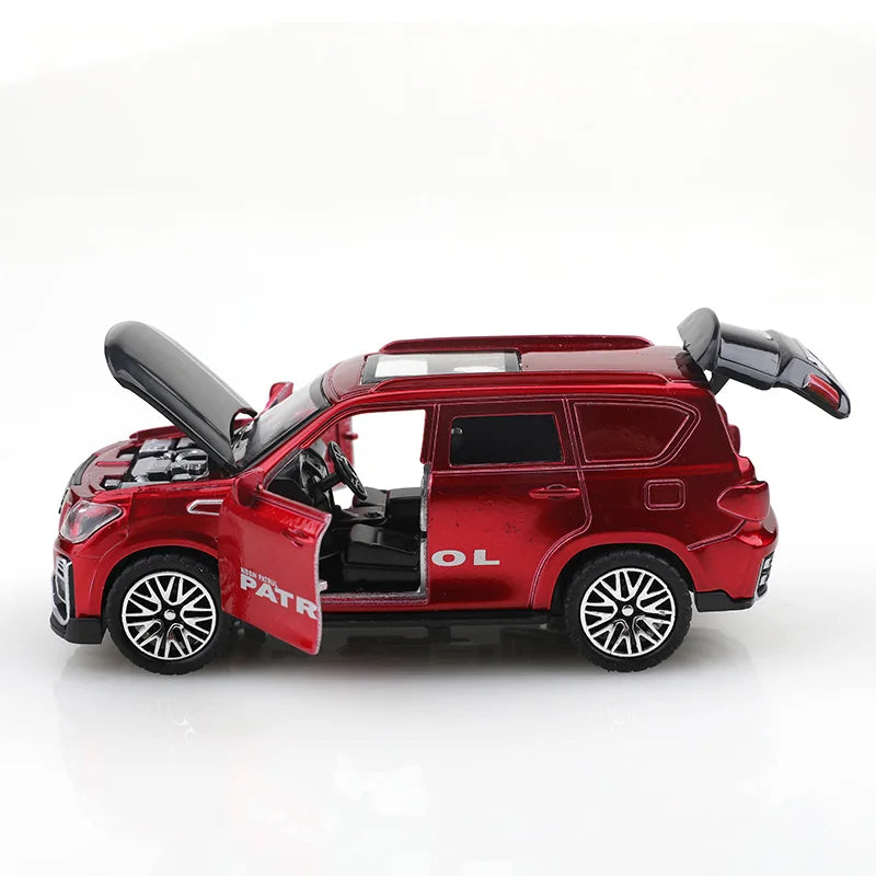 A red die-cast SUV toy with opening doors and pull-back action.