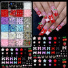 A collection of DIY nail art charms including bows, flowers, fruits, and butterflies in various colors and textures.