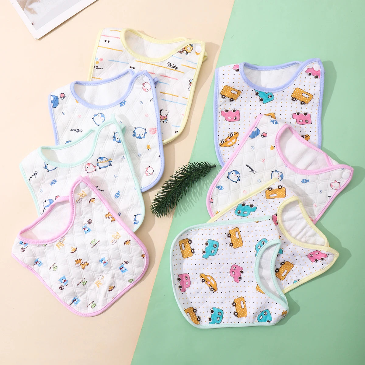 A set of three soft cotton baby bibs with adjustable closures featuring various cute animal and vehicle patterns.