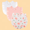 A set of three pure cotton muslin baby bibs in white and pink with floral embroidery