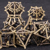 A set of metal dice shaped like dragons, used for D&D and tabletop RPGs.