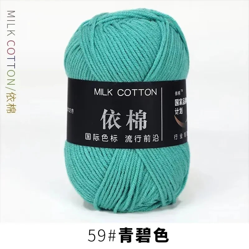 A skein of teal milk cotton yarn labeled with Chinese characters and the number 59