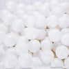 A pile of white, translucent play balls for ball pits and games.