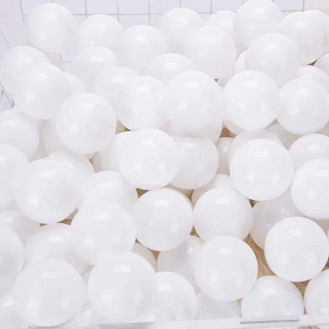 A pile of white, translucent play balls for ball pits and games.