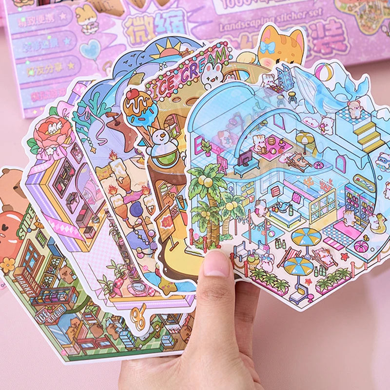 A hand is holding a colorful set of cartoon mini town diorama stickers featuring various buildings and characters.