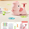 Pink foot launcher toy set with a main body, protective mask, and catching nets on a light surface.
