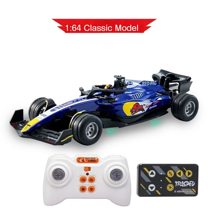 A blue 1:64 classic model F1 remote control race car with a controller and battery visible.