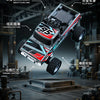 A detailed view of a black and red 1:64 scale off-road car with rubber tires and dynamic lighting.