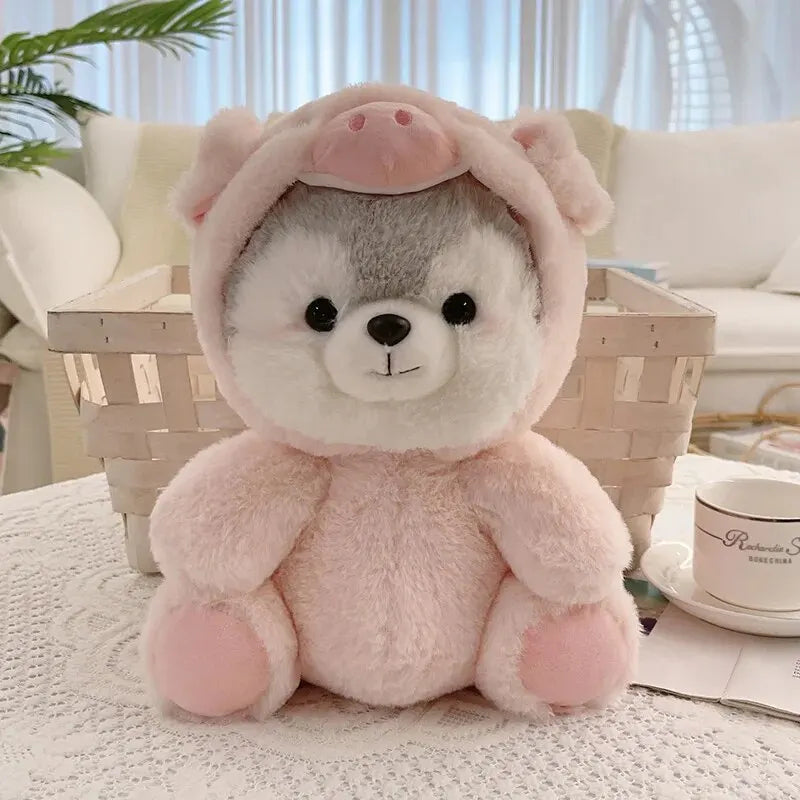 A pink husky plush toy with soft fur and ears sitting on a white surface.