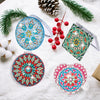DIY diamond art folding mirror with leather cover surrounded by pine needles and berries