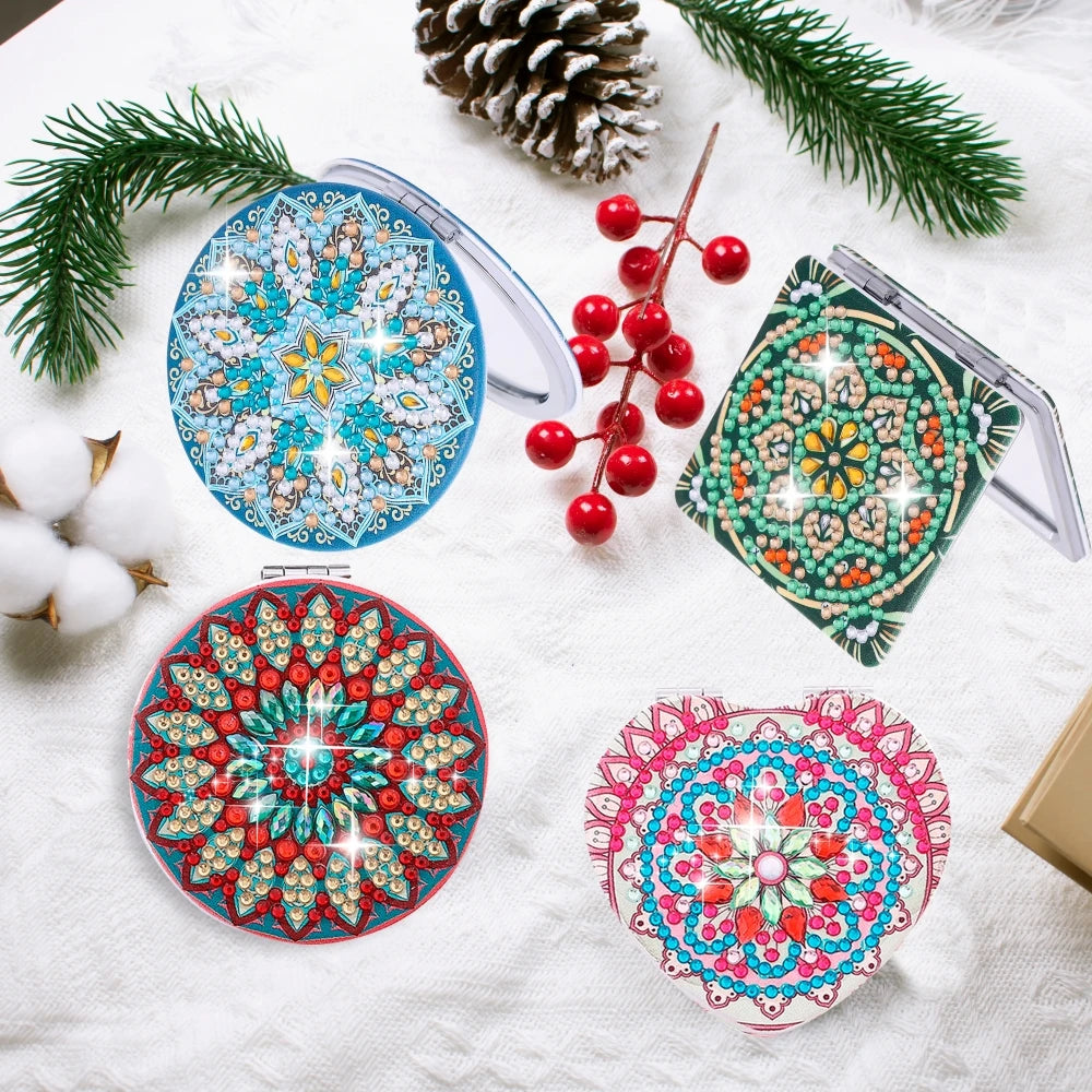 DIY diamond art folding mirror with leather cover surrounded by pine needles and berries