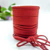 A roll of deep red velvet faux suede braided ribbon for crafting and gift wrapping.