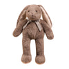 A soft brown bunny plush toy with long floppy ears tied with a ribbon.