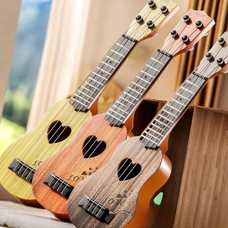 A collection of wooden toy guitars and ukuleles displayed in a natural, bright setting.