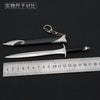 A collection of replica swords, including a metal blade and a black handle with silver inlay, displayed next to a ruler.