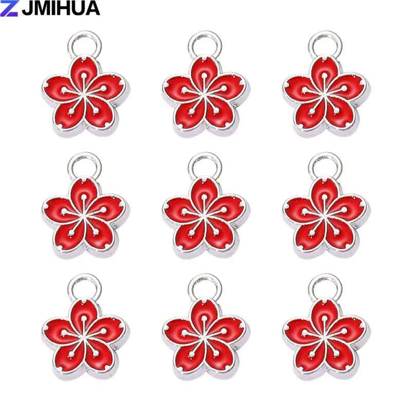 Fifteen enamel flower and cherry charms for jewelry making in silver-toned metal.