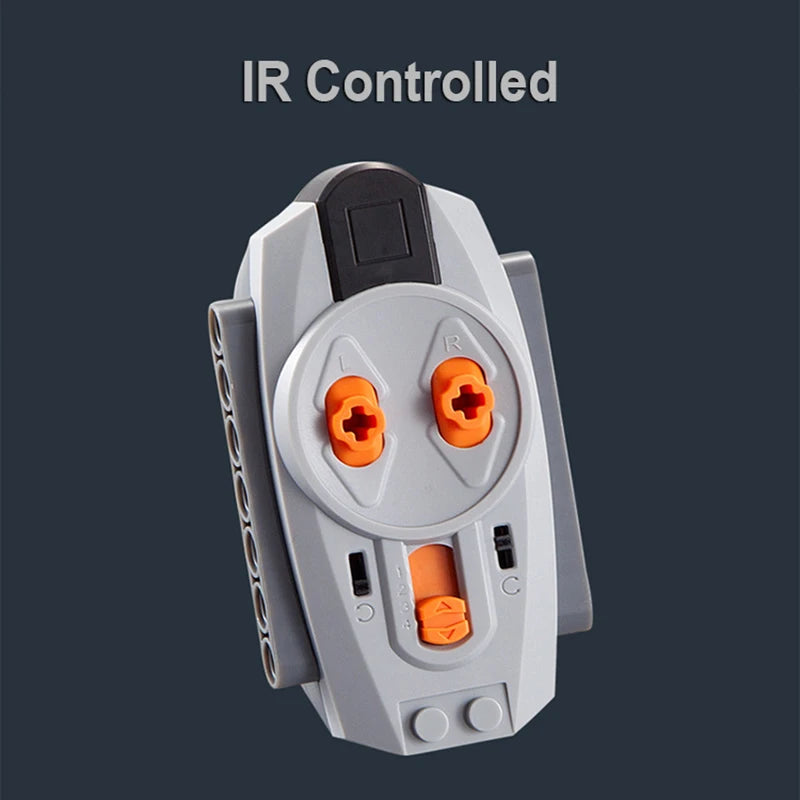 A gray technical power functions motor set for building blocks with orange components and an infrared controlled feature.