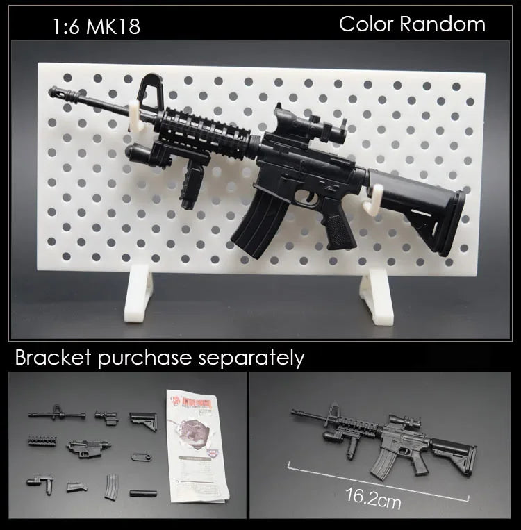 A black 1:6 scale military submachine gun model kit displayed on a white pegboard with separate bracket parts.