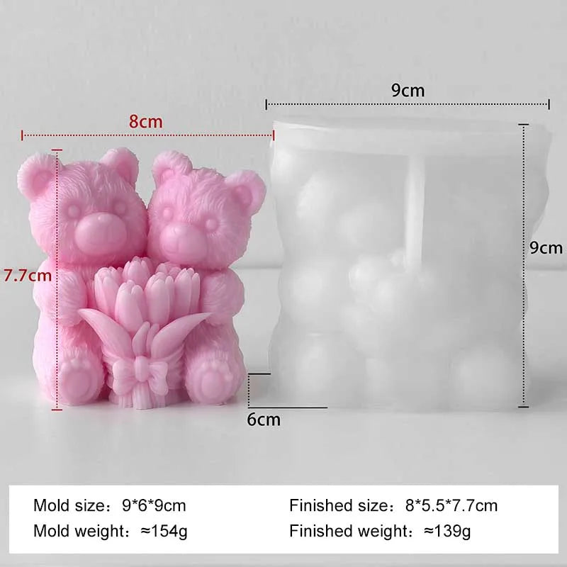 A pink silicone mold shaped like a bear and a rose, used for making candles or DIY crafts.