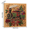 A framed diamond painting depicting a festive train decorated with pearls, jewels, and greenery.