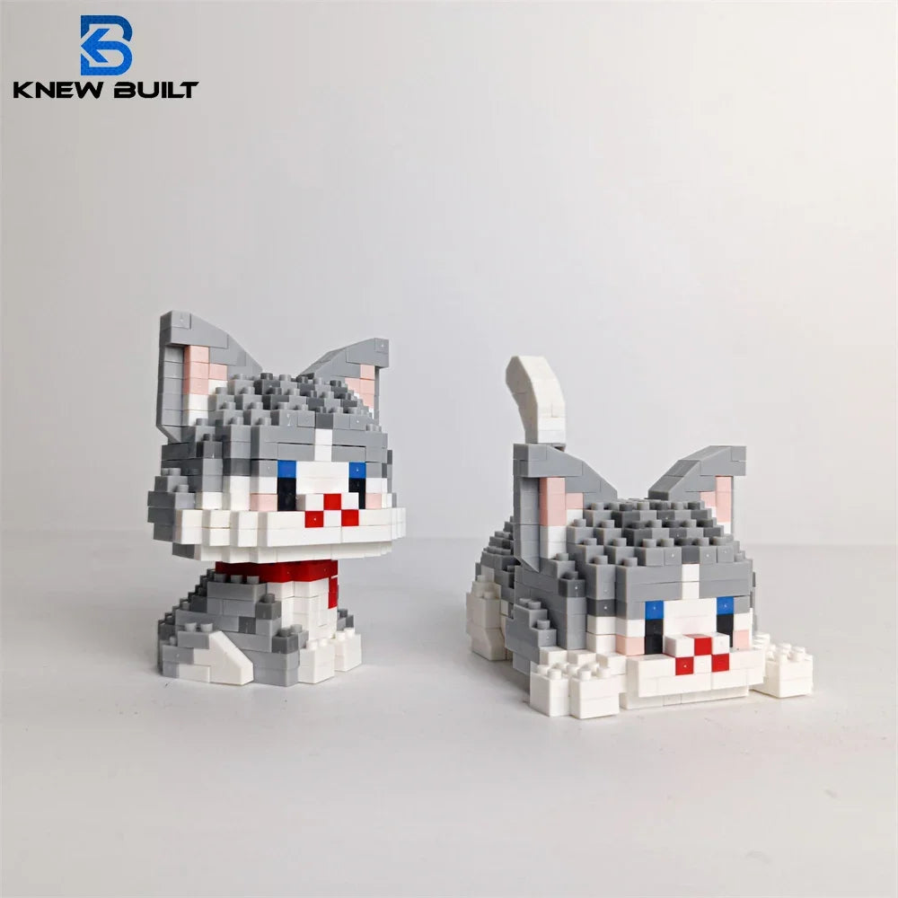 A gray and white cat figurine made from LEGO-style building blocks.
