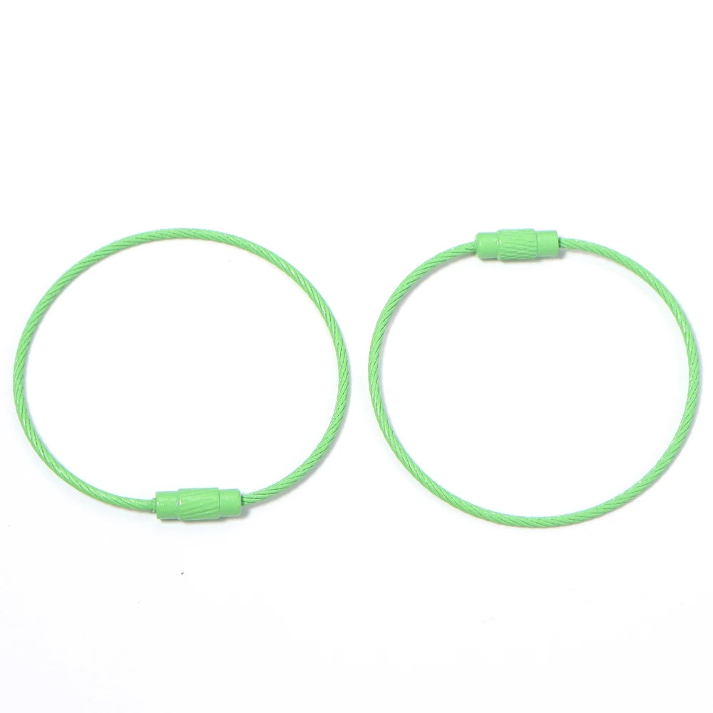 Ten stainless steel wire keychain rings with screw locks in a light green color