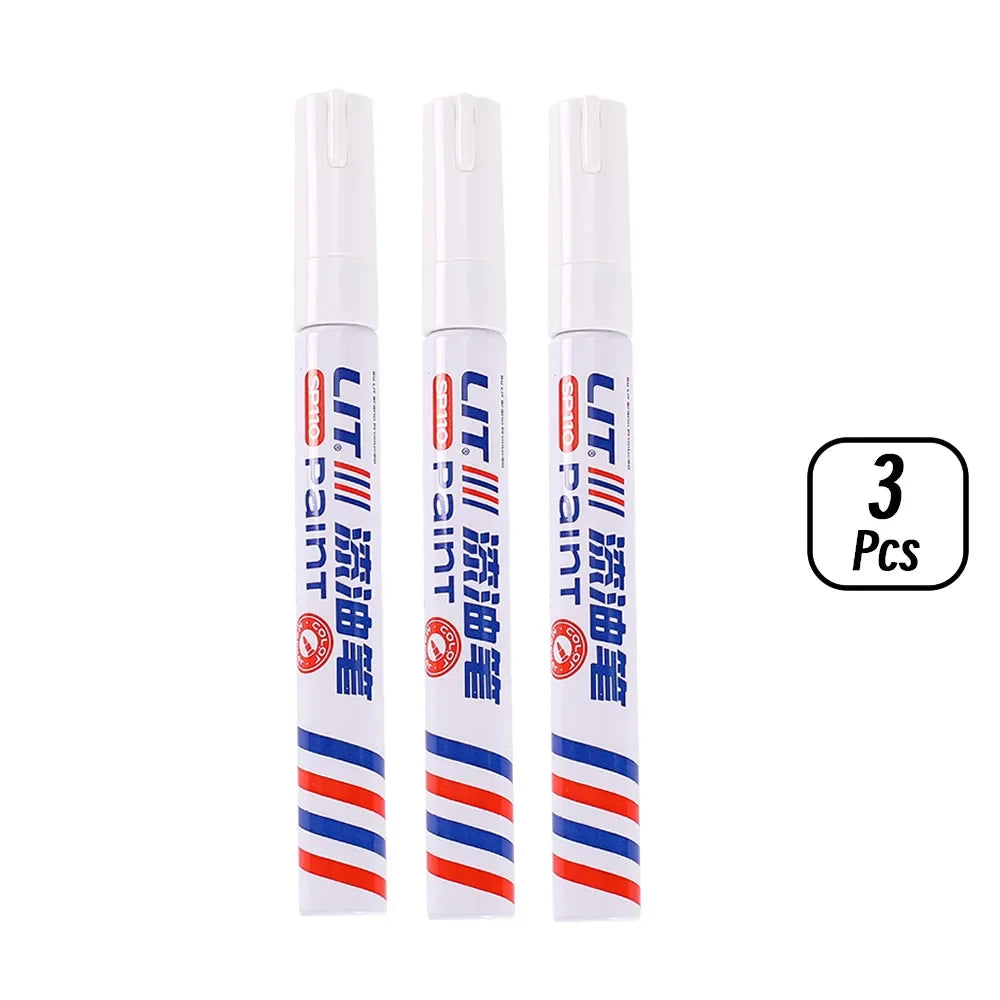 Three tubes of permanent paint markers for rubber, fabric, and metal in various colors.