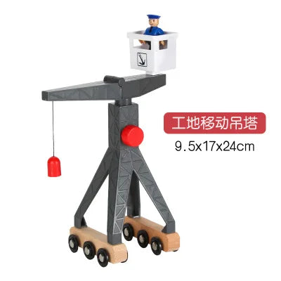 A wooden train track accessory set featuring an airport and gas station scene with a minifigure.
