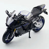 A black and silver Yamaha YZF-R1M diecast motorcycle model shown in a profile view.