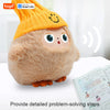 An orange knitted plush robot with large blue LED eyes and a smiling face sits on a white surface.