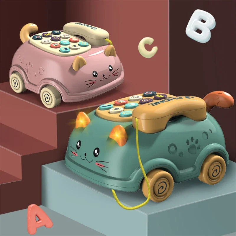 A pink and teal toy car shaped like a cat, featuring musical phone elements for toddlers.