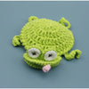 Handmade crochet lizard coaster in lime green with white eyes and pink tongue