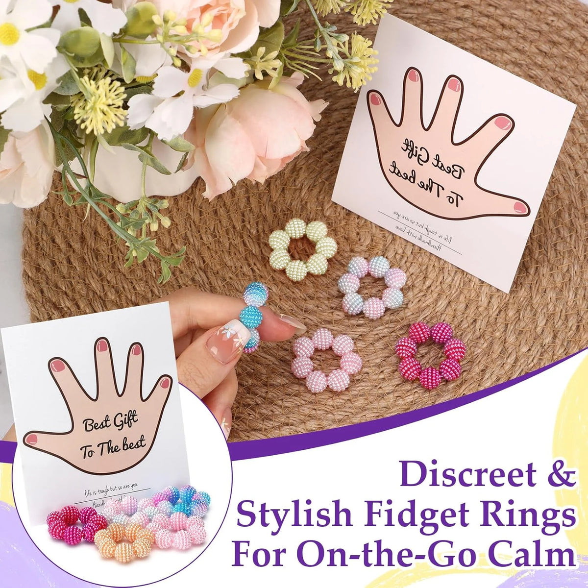 A hand holds a pink beaded fidget ring and a card featuring colorful beaded rings for on-the-go calm.