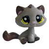 A charming bobble head pet figurine of a gray cat with large yellow eyes and brown fur.